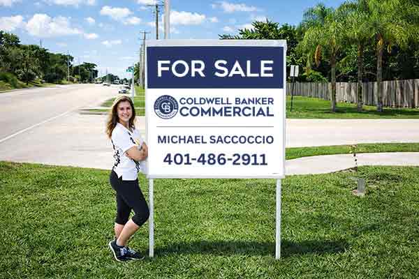 4x4 Coldwell Banker sign with metal post kit installed outdoors
