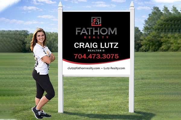 4x4 Fathom Realty sign mounted with PVC post kit